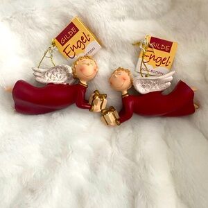 Gilde Angel Ornaments. Item no: 28064. Boy holding gift.